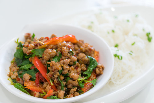 Stir fried pork with basil and boiled rice vermicelli