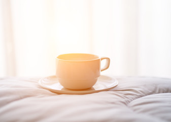 Fototapeta na wymiar Fresh morning coffee on the bed.