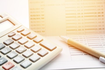 Business, finance savings or mortgage background concept ; Pen, calculator and savings account passbook on white background