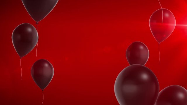 Black shiny balloons on a red background. Black Friday footage background.