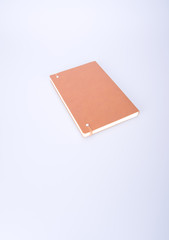 notebook or brown cover notebooks on the blackground.