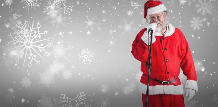 Composite image of santa claus singing songs against white backg
