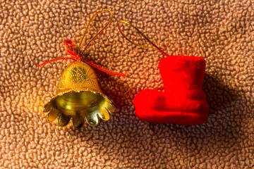 Still life foam sock with bell plastic on fabric christmas