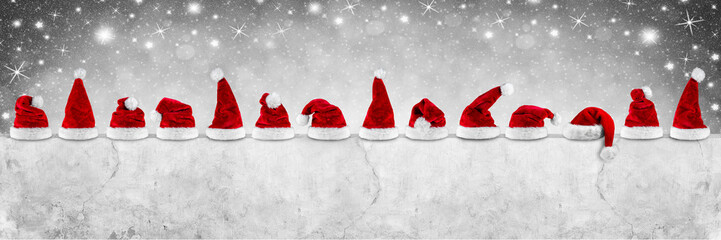 red white christmas santa hats on concrete wall empty billboard isolated on white background gray...