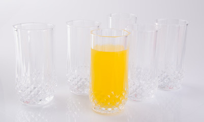 Orange juice in glasses on white background.