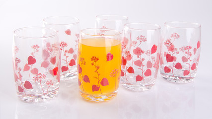 Orange juice in glasses on white background.