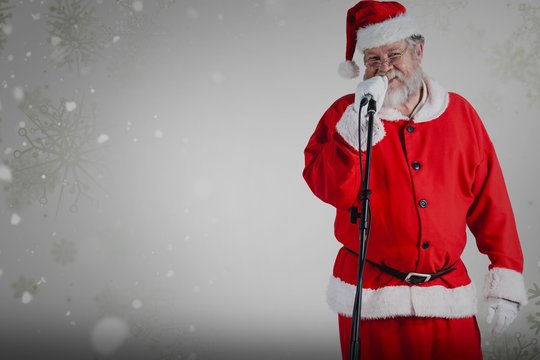 Composite image of santa claus singing songs against white backg