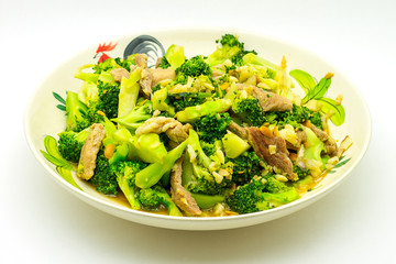 pork fillet with broccoli isolated on white