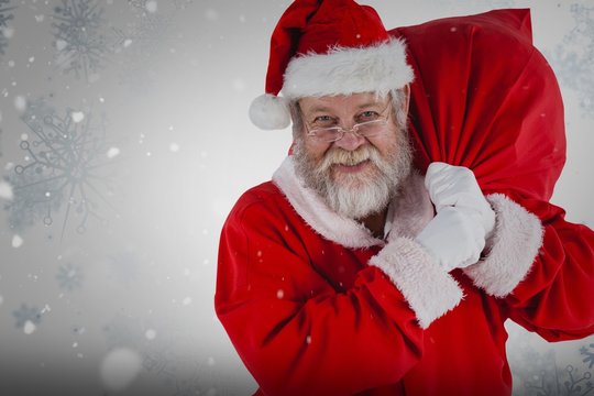 Composite image of portrait of santa claus holding christmas sac