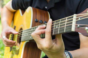 Fototapeta premium playing guitar in the park