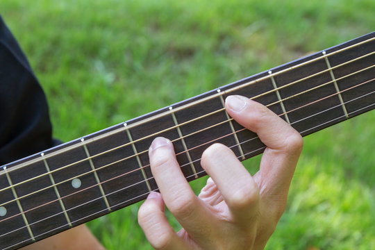 playing guitar in the park