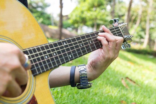 playing guitar in the park