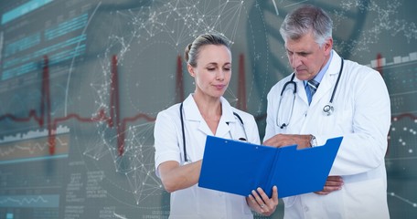 Composite image of male and female doctors discussing over notes