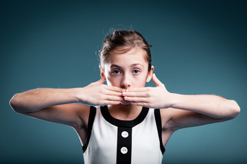 girl preventing herself to talk