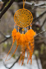 Dreamcatcher made of feathers, leather, beads, and ropes