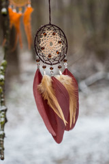 Dreamcatcher made of feathers, leather, beads, and ropes