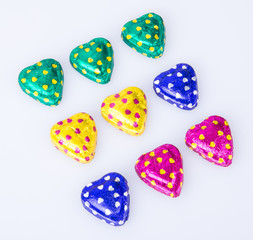 Chocolate or Colorful heart shape chocolate on a background.