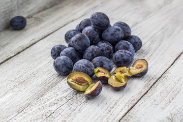 Fresh plums in cup
