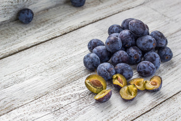 Fresh plums in cup