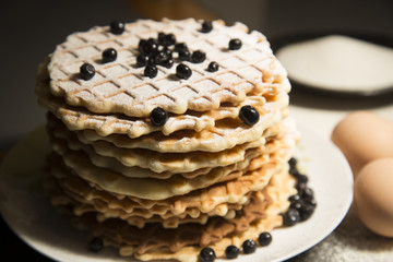 Fresh baked waffles topped with blueberries.