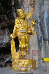 Fototapeta na wymiar Golden statue of a Chinese god at the Tiger Cave Temple ,Wat Tham Seua in Krabi, Thailand