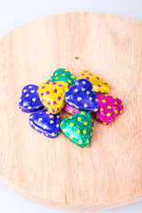 Chocolate or Colorful heart shape chocolate on a background.