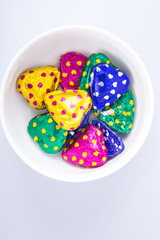Chocolate or Colorful heart shape chocolate on a background.