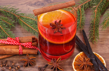 Mulled wine for christmas or winter evening with spices and spruce branches