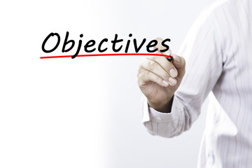 Businessman hand writing inscription "Objectives" with marker, c