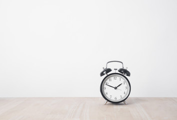 alarm clock on wood table with copy space for product display montage. - Powered by Adobe