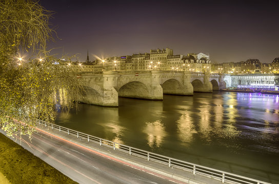Paris, France: Seine river and the old town at night
