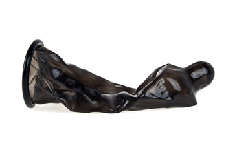 Black condom isolated on white background, ready to use