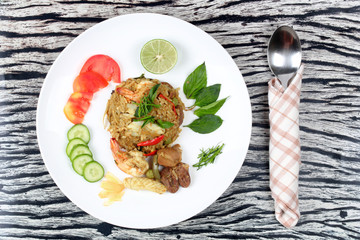 Fried jasmine rice in green curry with mixed meat.