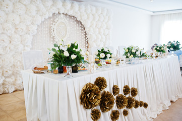 Table of newlyweds with flowers on white style.