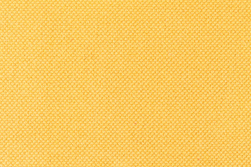 Background of yellow fabric, texture of the material, close up