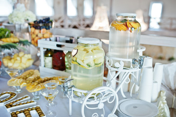 Fresh fruits lemonade on wedding reception table.