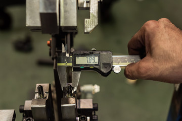 Vernier caliper measure diameter of locate pin in jig fixture structure