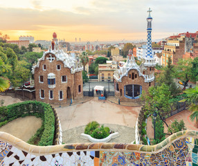 Park Guell in Barcelona. View to entrace houses with mosaics on foreground
