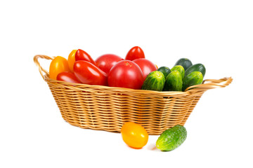 tomatoes and cucumbers in basket
