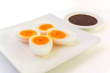 Medium boiled egg with spicy chilli sauce