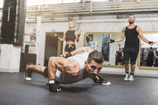 Athletes exercising in boxing club