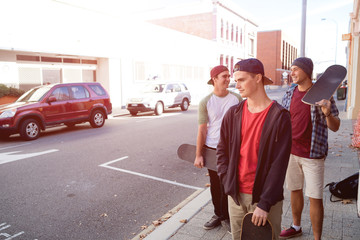 Guys skateboarders in street
