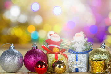 Christmas decoration on wooden table with blurred light background © jat306