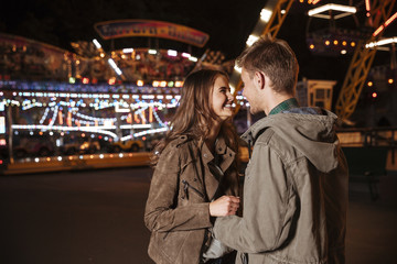Fototapeta na wymiar Romantic couple in amusement park