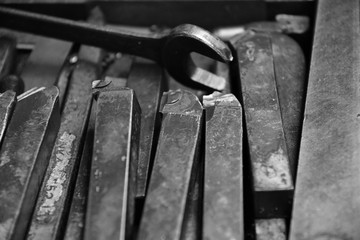 Tool of Obsolete lathe. Black-and-white photo.