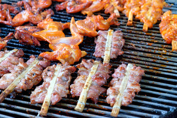  grill pork and chicken wing on bbq flaming grill