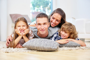 Happy family with two children at home