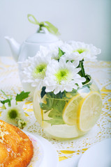 Yellow summer table setting with lemon bundt cake