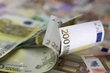 Euro currency background. Two hundred euros banknote is the main object.