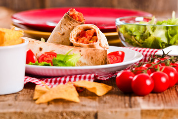 Tortilla wraps with chicken and vegetable.